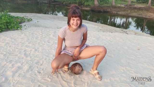 A Shy Girl Squirts a Small Trickle of Pee on a Coconut