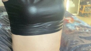 Trans girl in wet look, satin and stockings teasing