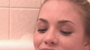 Little April rubbing and fingering pussy in the bathtub