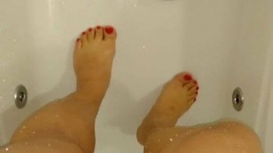 Joana Love in bath showing cock, legs and pissing